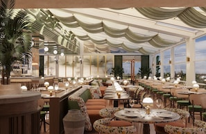 Een restaurant met verschillende tafels en stoelen, een bar en grote ramen voor natuurlijk licht.