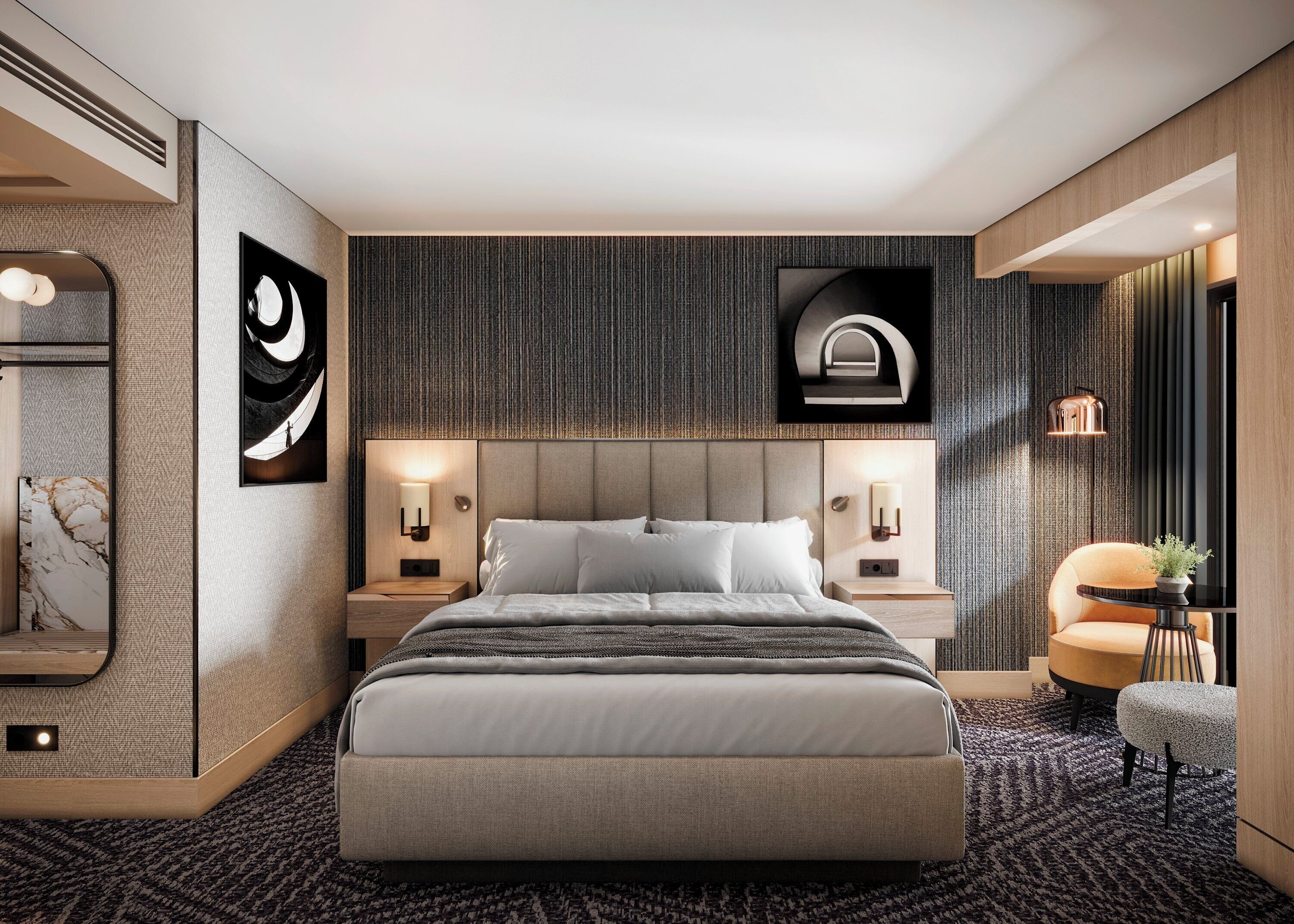 Una habitación de hotel moderna con una cama grande, dos mesitas de noche, una lámpara de pared y una pequeña mesa auxiliar con una planta.