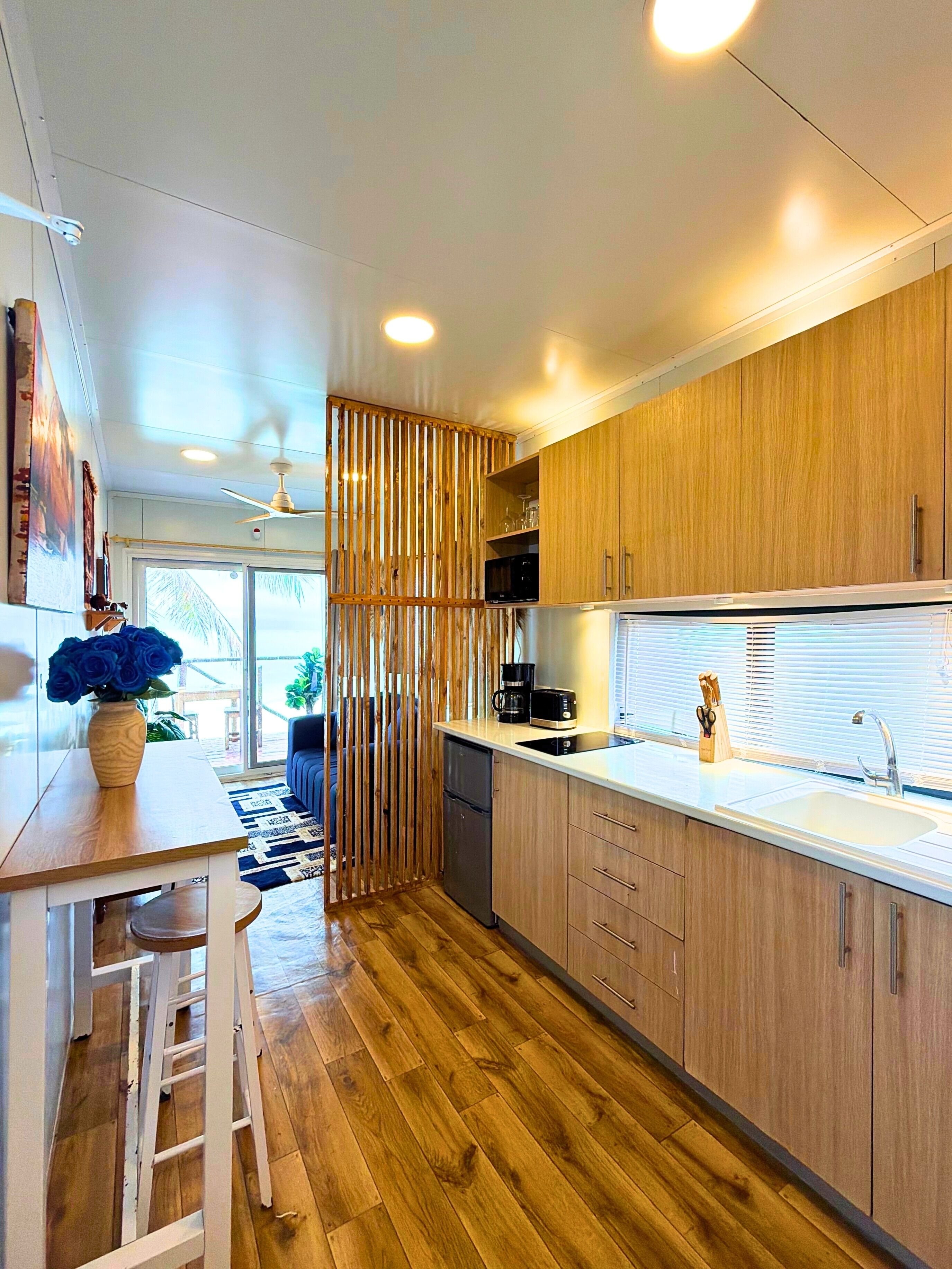 Mini-fridge, microwave, stovetop, coffee/tea maker