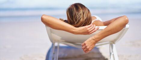 On the beach, sun loungers