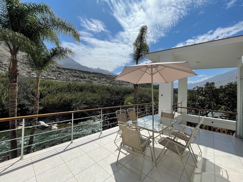 Riverfront house with private pool and garden 