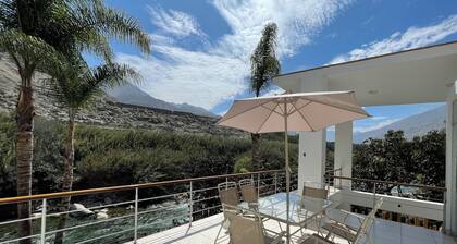 Riverfront house with private pool and garden