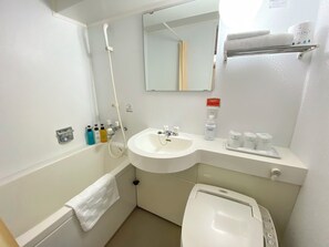 A bathroom with a sink, toilet, and shower. There are toiletries on the counter and a towel hanging on the wall. - Hotel Chatelet Inn Kyoto (Kyoto)