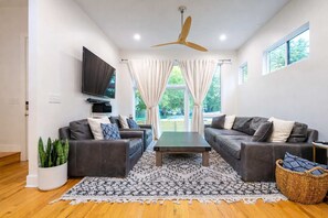 TV, offices - Modern Indy Mansion | Hot Tub • Rooftop Deck • 3BR (Indianapolis)