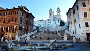 A grand staircase leading to a historic building with two towers. - Luxury modern apartment (Roma)
