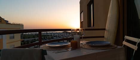 Enjoy a romantic dinner for two on the balcony with a view of the surrounding area.