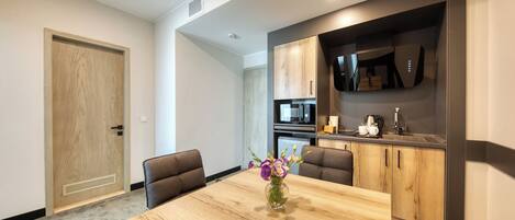 Senior Triple Room, 2 Bedrooms | Desk, laptop workspace, bed sheets