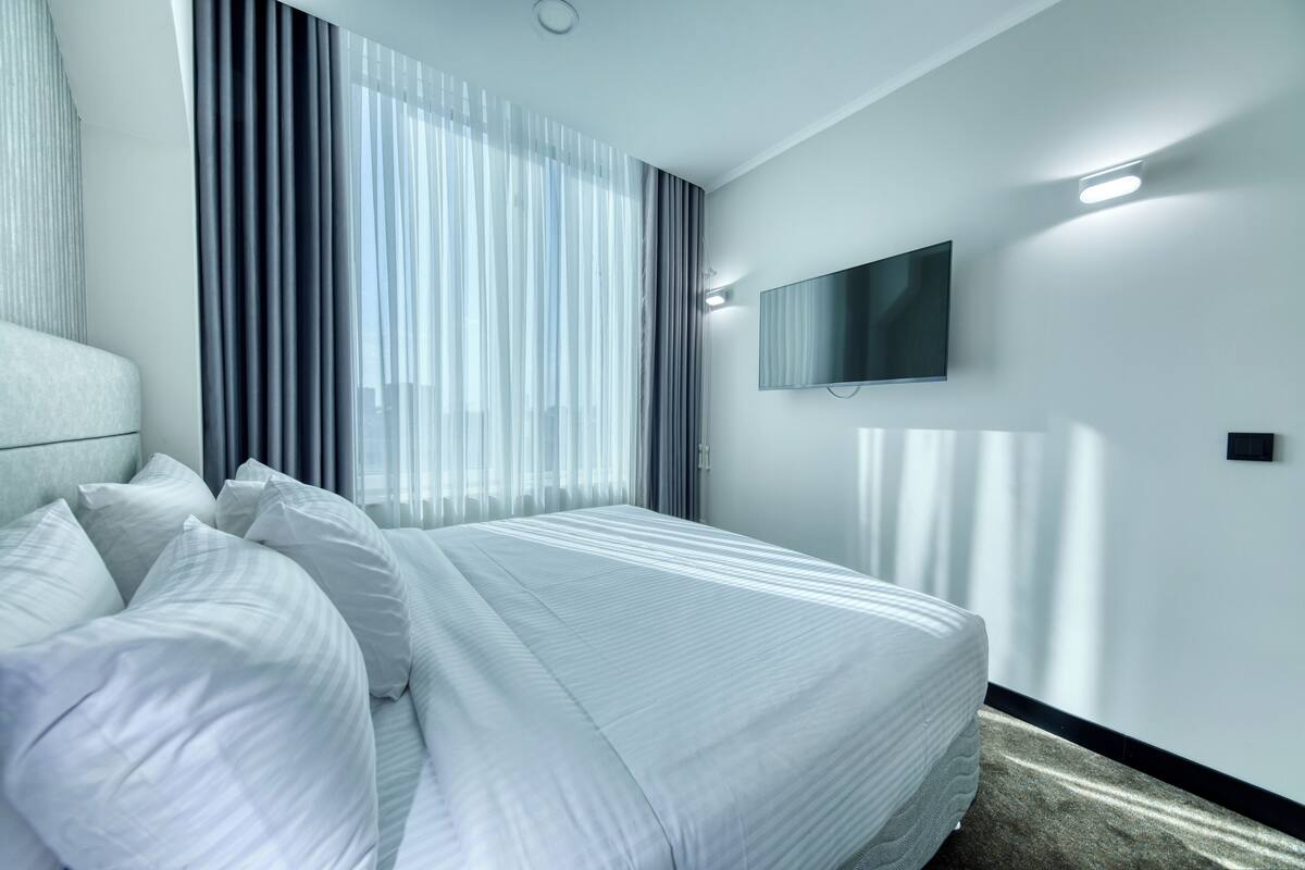 executive quadruple room, 2 bedrooms, city view | 1 bedroom, desk, laptop workspace, bed sheets