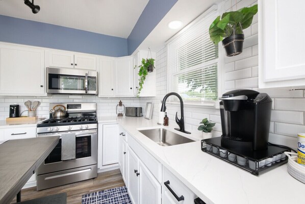 Fridge, microwave, stovetop, coffee/tea maker