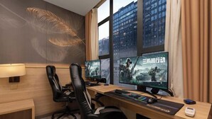 A modern office with two monitors, a desk, and a chair. - 24 Hours Banxing Hotel (Guiyang)