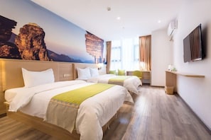 A hotel room with two beds, a large mural of rock formations, a flat-screen TV, and a wooden floor. - 24 Hours Banxing Hotel (Guiyang)