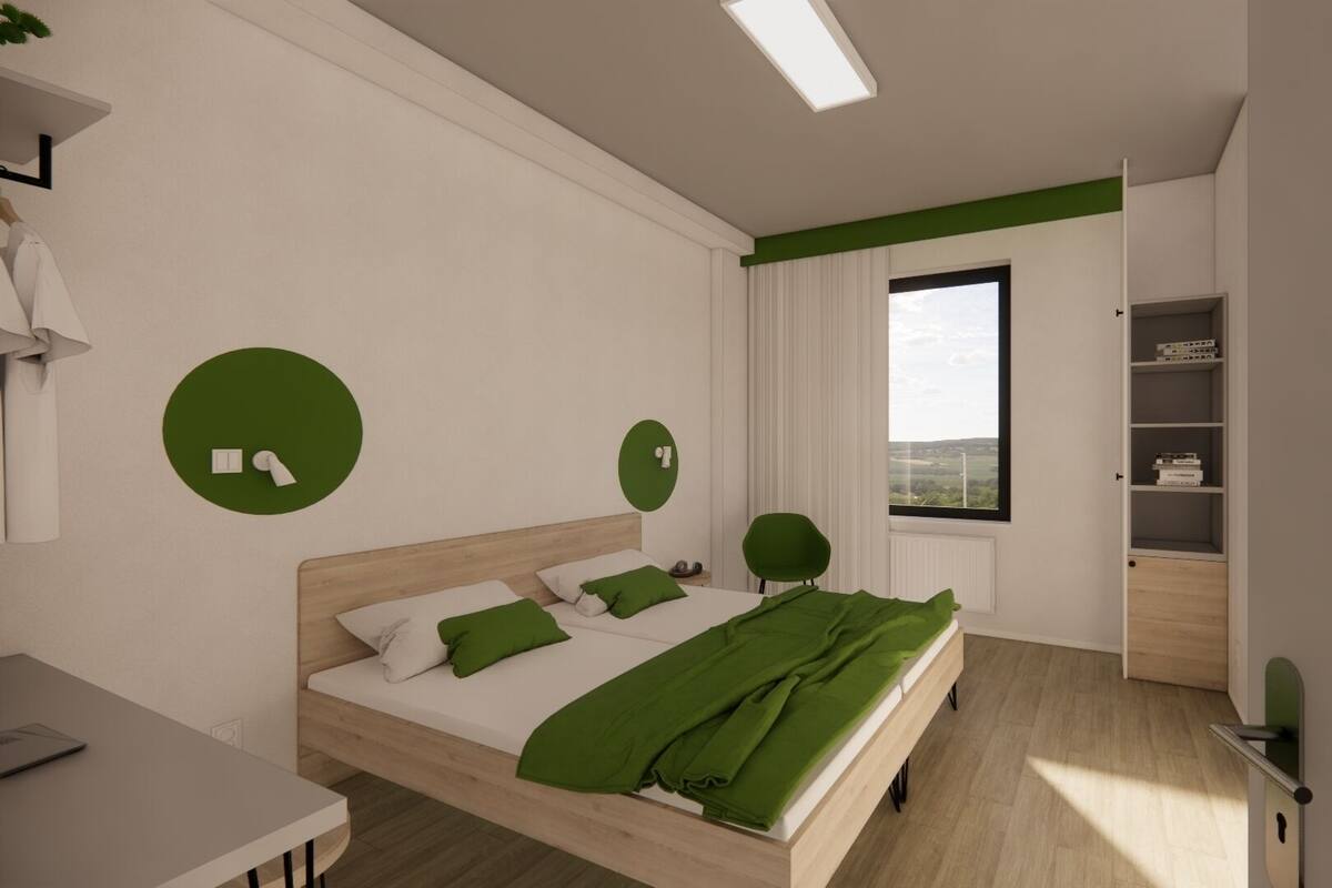 A modern bedroom with a bed, a desk, a chair, and a window with a view.