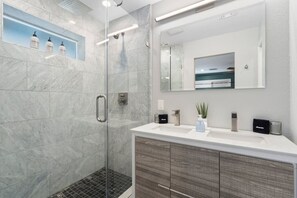 Bathtub, hair dryer, soap, shampoo