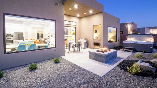 A modern house with a spacious patio, a barbecue area, and a well-lit interior. - SunChaser 2 Bed 2 bath Dog Friendly Private Home, Hot Tub, EV Charger (Washington)