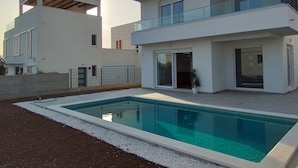 A modern two-story house with a swimming pool, large windows, and a balcony. - Villa With Panoramic Views on the Sea, Islands, City and Hill (Kaštel Sućurac)
