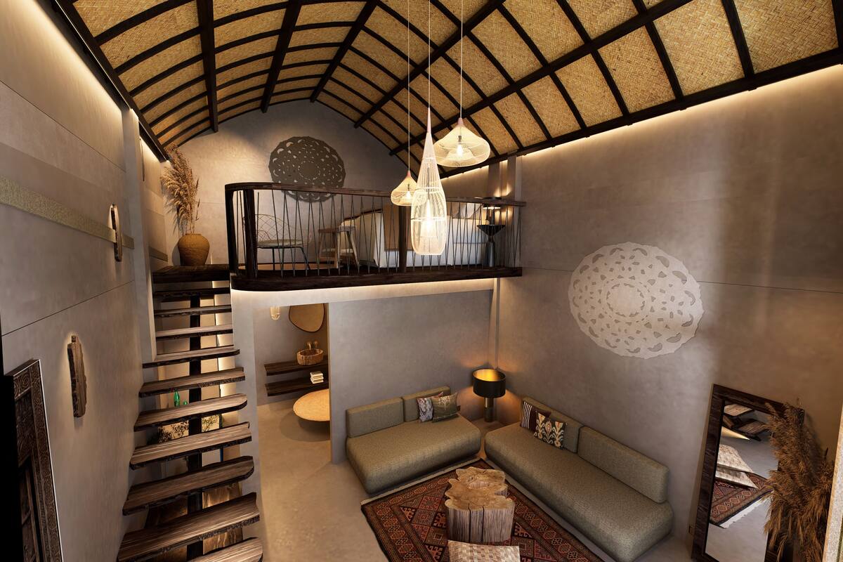 A modern interior with a staircase, a seating area, and a ceiling with a woven pattern.