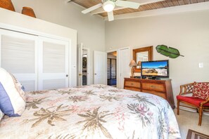 A bedroom with a bed, a television, a dresser, and a chair. - Wailea Ekolu #306 Panoramic Ocean Views on Wailea Golf Course, Wifi, A/C (Wailea)