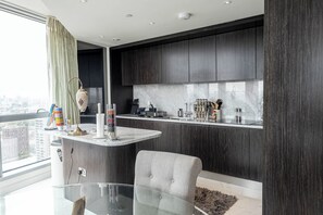 Deluxe Apartment, 3 Bedrooms, City View | Private kitchen | Full-size fridge, microwave, oven, dishwasher