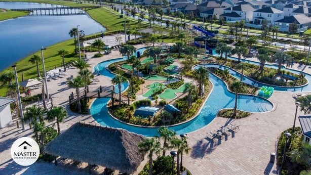A resort with a central pool area, multiple water features, and a surrounding residential neighborhood. - 9 Bedrooms S / Storey Lake Home by RedAwning (Kissimmee)
