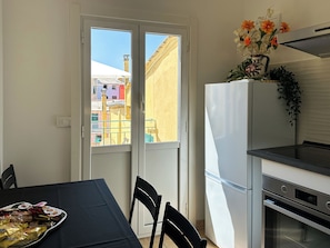 Exclusive Apartment | Private kitchen | Full-size fridge, microwave, oven, stovetop