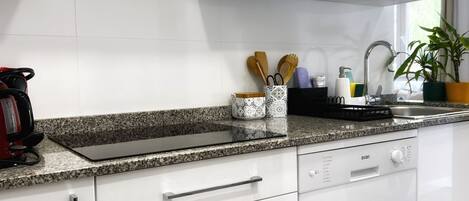 Microwave, stovetop, dishwasher, coffee/tea maker