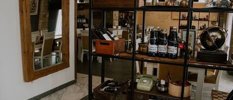 A wine rack with bottles and a globe.