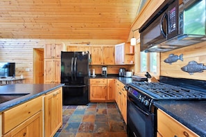 Cabin, Multiple Beds, Kitchen | Private kitchen | Fridge, microwave, oven, stovetop