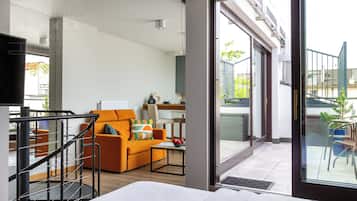 Design Studio, 1 Queen Bed with Sofa bed | Living area | Flat-screen TV