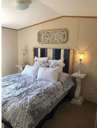 Lazy Tank Mobile Home sits above a little tank.  Sunsets are incredible.