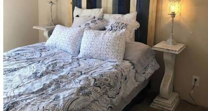 Lazy Tank Mobile Home sits above a little tank. Sunsets are incredible.