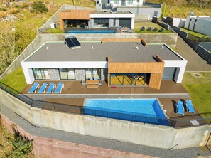 Relax on the rooftop terrace with a swimming pool, taking in views of the surrounding area.
