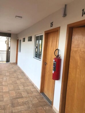 Guest rooms are accessible via numbered doors along this corridor.