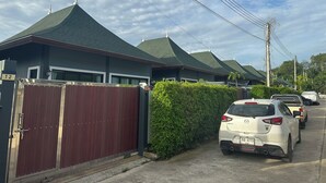 A row of modern houses with green roofs and a gated driveway. - Luxury Private Pool Villa- Ao Nang Krabi  (Tambon Ao Nang)
