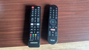Two remote controls on a wooden surface. - Luxury Private Pool Villa- Ao Nang Krabi  (Tambon Ao Nang)