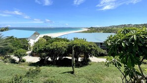 A coastal property with a clear view of the beach and ocean.