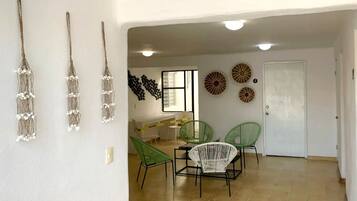 Comfort Suite | Living area | 40-inch flat-screen TV with digital channels