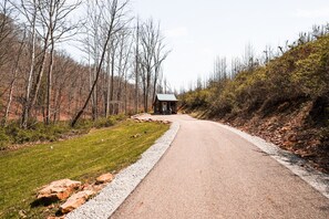 A rural road with a small cabin on the right. - Snuggle Bear | Hocking Hills, Adorable Tiny Home (Logan)