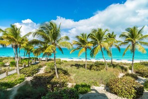 On the beach, sun-loungers, beach towels