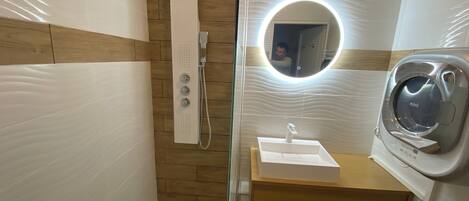 Shower, hair dryer, towels, soap