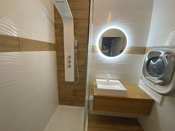 Shower, hair dryer, towels, soap