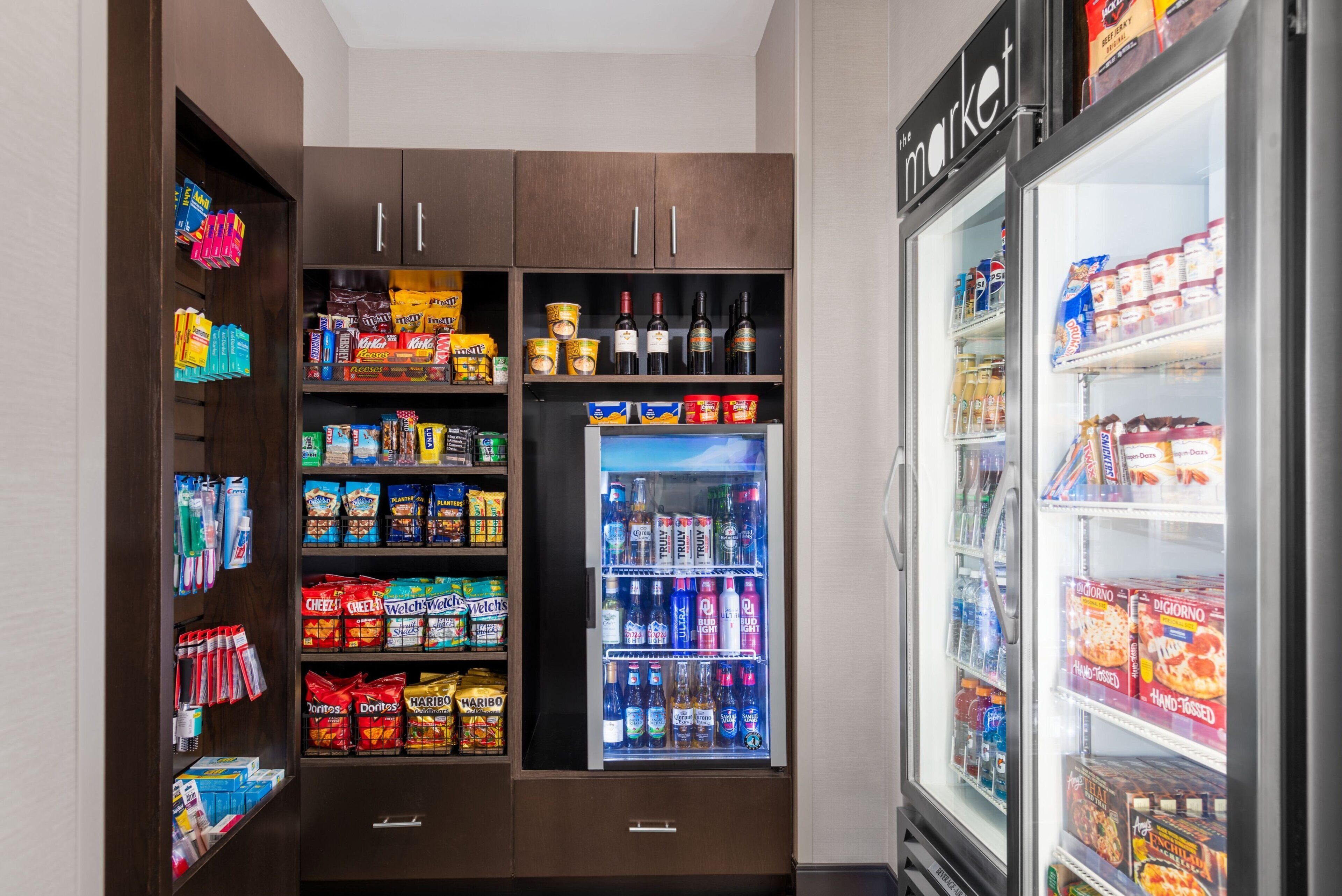 A vending machine area with snacks, beverages, and condiments.