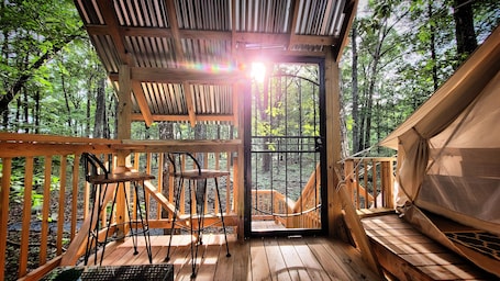 Property grounds. Mountain Bell tent Tree house providing views of surrounding mountains and lake.