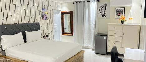 Premium bedding, laptop workspace, soundproofing, individually decorated