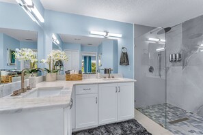 Shower, hair dryer, towels, soap