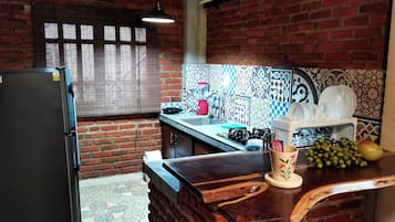 Fridge, coffee/tea maker, cookware/dishes/utensils