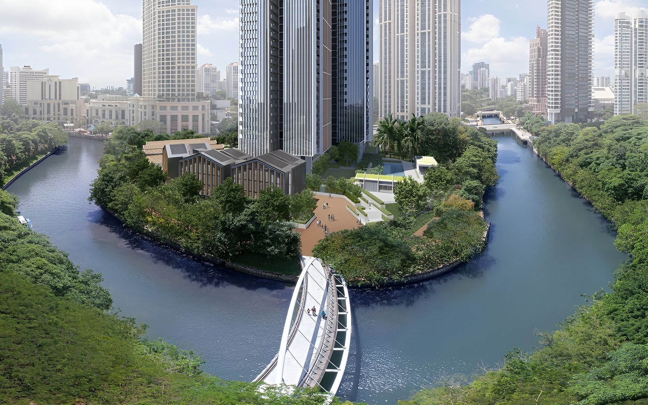 A river with a pedestrian bridge, surrounded by greenery and modern buildings.