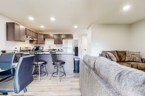 Cozy living space with a kitchenette, dining area, and comfortable seating.