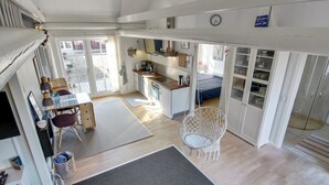 A compact, open-plan living space with a kitchen, dining area, and sleeping area. - "Gisella" - 6km from the sea by Interhome (Aakirkeby)