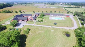 An aerial view of a large property with multiple buildings, a swimming pool, and extensive green fields. - "Antine" - 6km from the sea by Interhome (Aakirkeby)