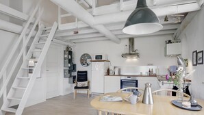 A modern kitchen with white cabinets, a stainless steel kettle, and a coffee machine. - "Antine" - 6km from the sea by Interhome (Aakirkeby)